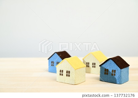 A miniature house placed on a wooden table A miniature house placed on a wooden table 137732176