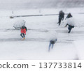 People walking in heavy snow 137733814