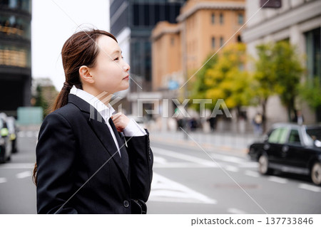 A businessman carrying a carry-on bag A businessman carrying a carry-on bag 137733846