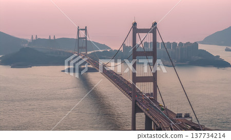 Iconic Suspension Bridge Illuminated At Sunset Over Tranquil Waters Feb 21 2026 Iconic Suspension Bridge Illuminated At Sunset Over Tranquil Waters Feb 21 2026 137734214