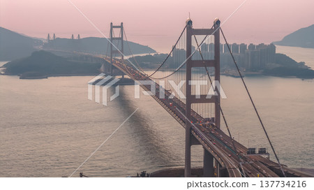 Iconic Suspension Bridge Illuminated At Sunset Over Tranquil Waters Feb 21 2026 Iconic Suspension Bridge Illuminated At Sunset Over Tranquil Waters Feb 21 2026 137734216