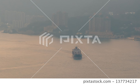Quiet Coastal Bay Overlooking High Rises Beneath Hazy Hills Feb 21 2026 137734217