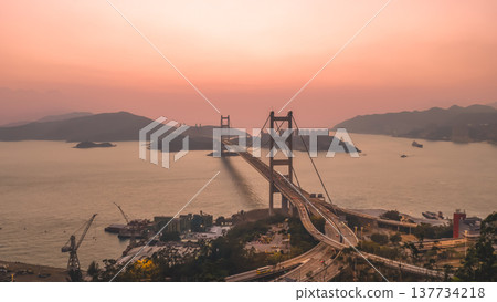 Iconic Suspension Bridge Illuminated At Sunset Over Tranquil Waters Feb 21 2026 Iconic Suspension Bridge Illuminated At Sunset Over Tranquil Waters Feb 21 2026 137734218