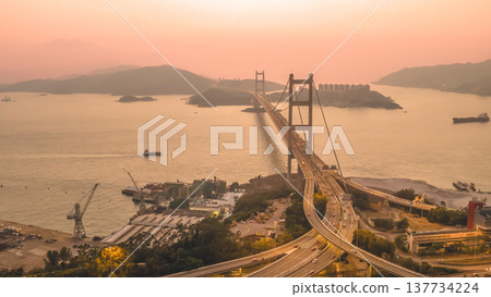 Iconic Suspension Bridge Illuminated At Sunset Over Tranquil Waters Feb 21 2026 Iconic Suspension Bridge Illuminated At Sunset Over Tranquil Waters Feb 21 2026 137734224
