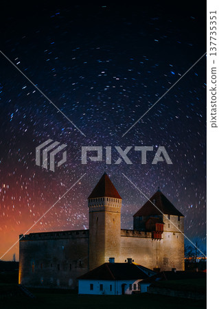Star trails over the medieval Kuressaare Castle during a winter night 137735351