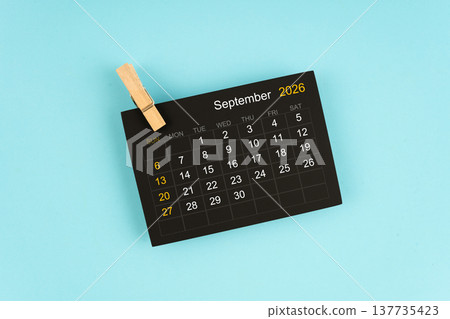Black calendar sheet for September 2026 with wooden clips. Black calendar sheet for September 2026 with wooden clips. 137735423