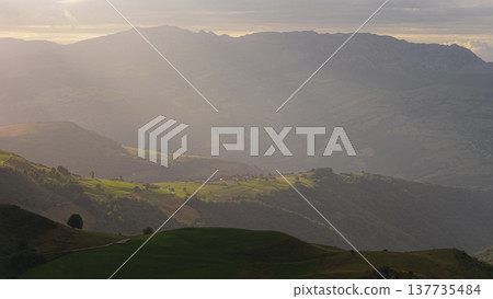 Cantabria valley and mountains with sunbeams at sunset 137735484