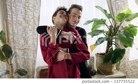 Gay couple embracing enjoying love at home 137735522