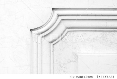 Detailed view of a decorative marble and stucco element in classic architecture 137735883