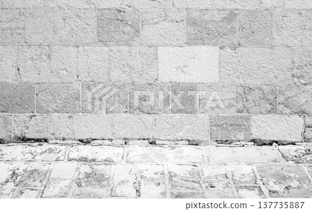 Old gray stone wall and flooring, an empty abstract interior, background texture Old gray stone wall and flooring, an empty abstract interior, background texture 137735887