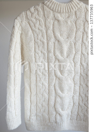 Children's warm white wool sweater isolated on white background 137735963
