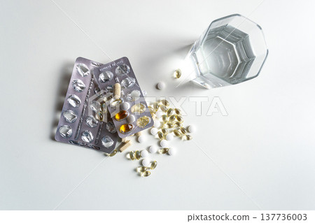 Variety of forms and blisters of vitamin D on a white table Variety of forms and blisters of vitamin D on a white table 137736003