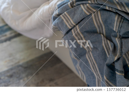 White blanket with dirty duvet cover removed for washing White blanket with dirty duvet cover removed for washing 137736012