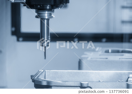 High-precision hole making process on aluminum automotive components using a CNC milling machine in a modern factory. 137736091