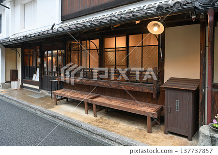 A landscape of traditional storehouses and namako-style walls along the street in Uchiko, a designated Important Preservation District for Groups of Traditional Buildings. A landscape of traditional storehouses and namako-style walls along the street in Uchiko, a designated Important Preservation District for Groups of Traditional Buildings. 137737857