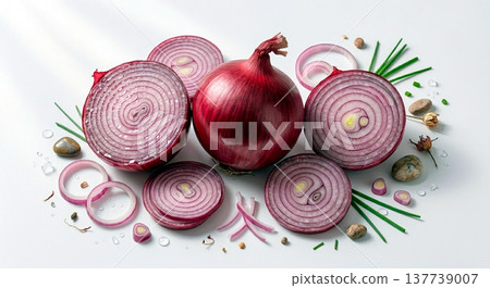 A vibrant composition of fresh red onions, featuring a whole bulb, halves, and precise rings arranged with green chives and small stones on a clean white surface. Ideal for culinary photography 137739007