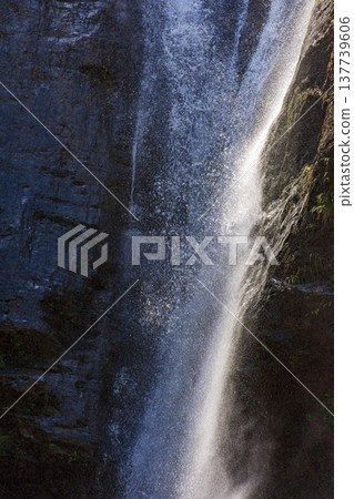 Water from a waterfall splashing 137739606