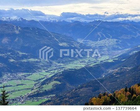 View of the valley among the Alpine mountains covered with snow View of the valley among the Alpine mountains covered with snow 137739664