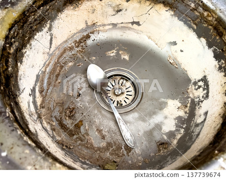 Large dirty metal sink covered with lime and rust for washing dishes in kitchen Large dirty metal sink covered with lime and rust for washing dishes in kitchen 137739674