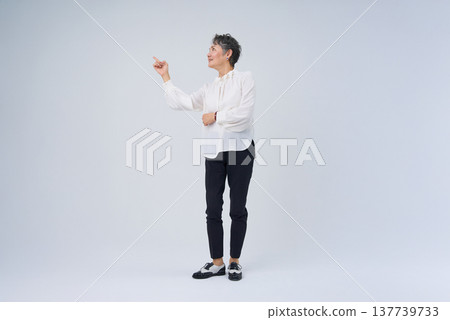 Senior woman making a gesture with her finger raised 137739733