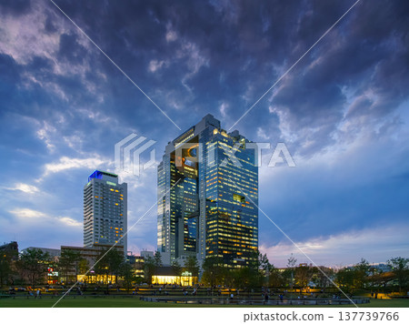 Osaka, Japan - Sep 25 2024, Panoramic view of Umeda Sky Building with an illuminating ring at the top between two towers, with a skyscraper near to it, at evening, without people, Osaka, Japan Osaka, Japan - Sep 25 2024, Panoramic view of Umeda Sky Building with an illuminating ring at the top between two towers, with a skyscraper near to it, at evening, without people, Osaka, Japan 137739766