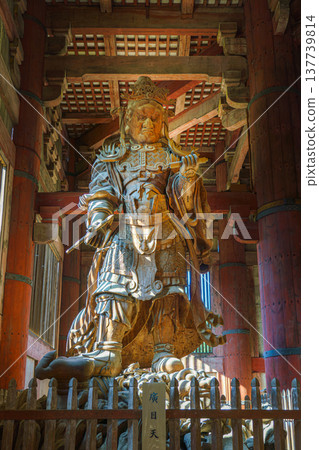 Nara, Japan - Sep 26 2024, vertical view from below of the ancient wooden statue of Komokuten, one of the two guardians of the four directions in Todaiji Temple, without people, Nara, Japan Nara, Japan - Sep 26 2024, vertical view from below of the ancient wooden statue of Komokuten, one of the two guardians of the four directions in Todaiji Temple, without people, Nara, Japan 137739814