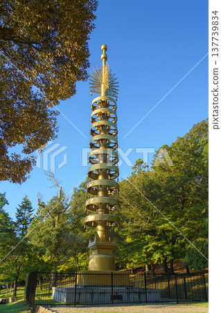 Nara, Japan - Sep 24 2025, vertical view of bronze sorin, an architectural element that decorated the top of Pagoda, surrounded by foliage of trees, in Nara Park on territory of Todaij, Nara, Japan Nara, Japan - Sep 24 2025, vertical view of bronze sorin, an architectural element that decorated the top of Pagoda, surrounded by foliage of trees, in Nara Park on territory of Todaij, Nara, Japan 137739834
