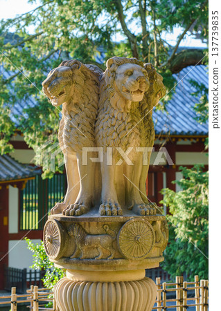Nara, Japan - Sep 26 2024, vertical view of statue of three lions looking in different directions landmark on territory of Todaiji Temple, trees in background, without people, at daytime, Nara, Japan Nara, Japan - Sep 26 2024, vertical view of statue of three lions looking in different directions landmark on territory of Todaiji Temple, trees in background, without people, at daytime, Nara, Japan 137739835
