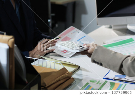 Business woman accountant working in office checking financial accounts and allocating company budgets. 137739965