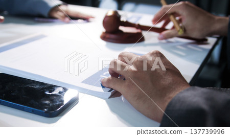 Consultation and conference of professional businesswoman and Male lawyers working and discussion having at law firm in office. Concepts of law, Judge gavel with scales of justice 137739996