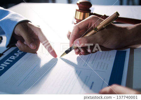Consultation and conference of professional businesswoman and Male lawyers working and discussion having at law firm in office. Concepts of law, Judge gavel with scales of justice Consultation and conference of professional businesswoman and Male lawyers working and discussion having at law firm in office. Concepts of law, Judge gavel with scales of justice 137740001