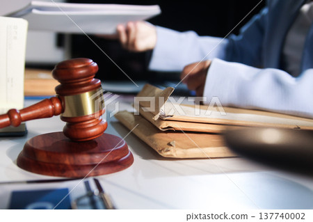 Consultation and conference of professional businesswoman and Male lawyers working and discussion having at law firm in office. Concepts of law, Judge gavel with scales of justice 137740002