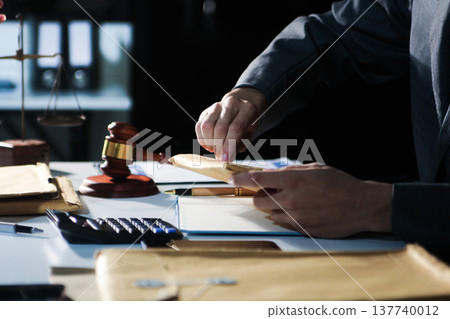 Consultation and conference of professional businesswoman and Male lawyers working and discussion having at law firm in office. Concepts of law, Judge gavel with scales of justice Consultation and conference of professional businesswoman and Male lawyers working and discussion having at law firm in office. Concepts of law, Judge gavel with scales of justice 137740012