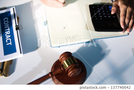 Consultation and conference of professional businesswoman and Male lawyers working and discussion having at law firm in office. Concepts of law, Judge gavel with scales of justice Consultation and conference of professional businesswoman and Male lawyers working and discussion having at law firm in office. Concepts of law, Judge gavel with scales of justice 137740042