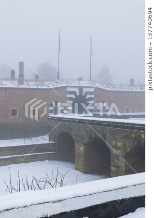Mala Pevnost Terezin fortress entering on foggy winter day 137740694