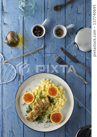 Healthy salmon and couscous dinner with red caviar 137740695