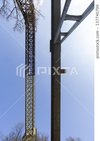 Engineering structures standing tall against blue sky in Czechia Engineering structures standing tall against blue sky in Czechia 137740700