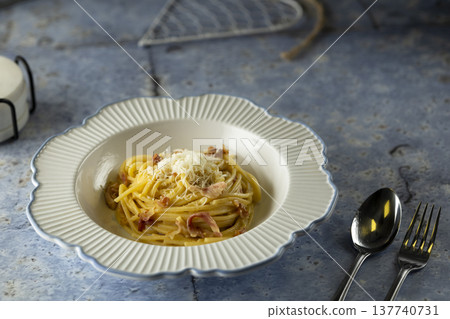 Spaghetti carbonara with bacon and cheese on plate Spaghetti carbonara with bacon and cheese on plate 137740731