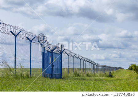 Security fence with barbed wire and gate in Hostivice Security fence with barbed wire and gate in Hostivice 137740886