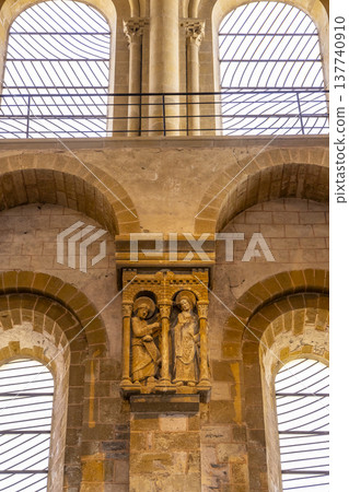 Romanesque stone carving depicting Mary and angel Gabriel inside Conques Abbey Romanesque stone carving depicting Mary and angel Gabriel inside Conques Abbey 137740910