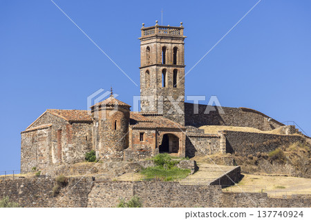 Almonaster la Real mosque church bell tower against blue sky Almonaster la Real mosque church bell tower against blue sky 137740924