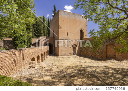 Alhambra complex tower and brick wall in Granada, Spain Alhambra complex tower and brick wall in Granada, Spain 137740936