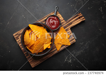 Nachos tortilla chips salsa dip wooden board Mexican Tex-Mex snack fast food 137740974