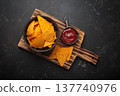Nachos tortilla chips salsa dip wooden board Mexican Tex-Mex snack fast food 137740976