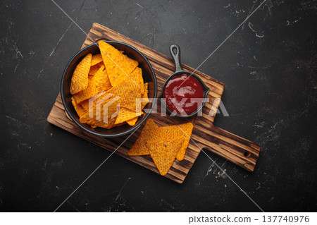 Nachos tortilla chips salsa dip wooden board Mexican Tex-Mex snack fast food Nachos tortilla chips salsa dip wooden board Mexican Tex-Mex snack fast food 137740976