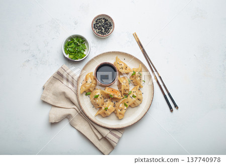 Gyoza dumplings soy sauce chopsticks asian Japanese food wontons 137740978