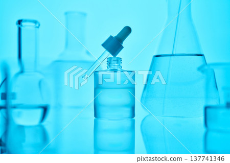 Skincare serum dropper preparing cosmetic product in laboratory 137741346