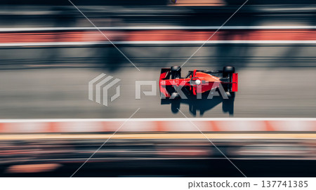 Red racing car speeding on a blurred track. Racing car creating motion blur effect on a track, viewed from above 137741385