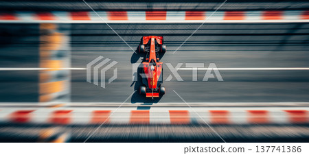Red racing car speeding on a blurred track. Racing car creating motion blur effect on a track, viewed from above Red racing car speeding on a blurred track. Racing car creating motion blur effect on a track, viewed from above 137741386