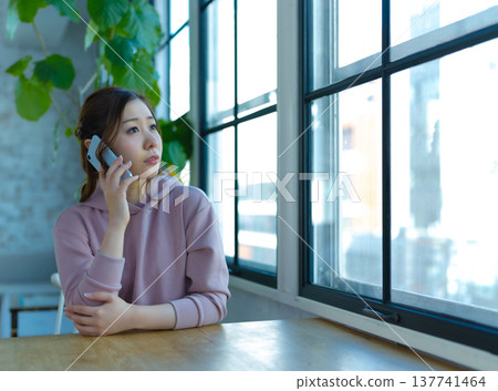 Women calling by the window Women calling by the window 137741464